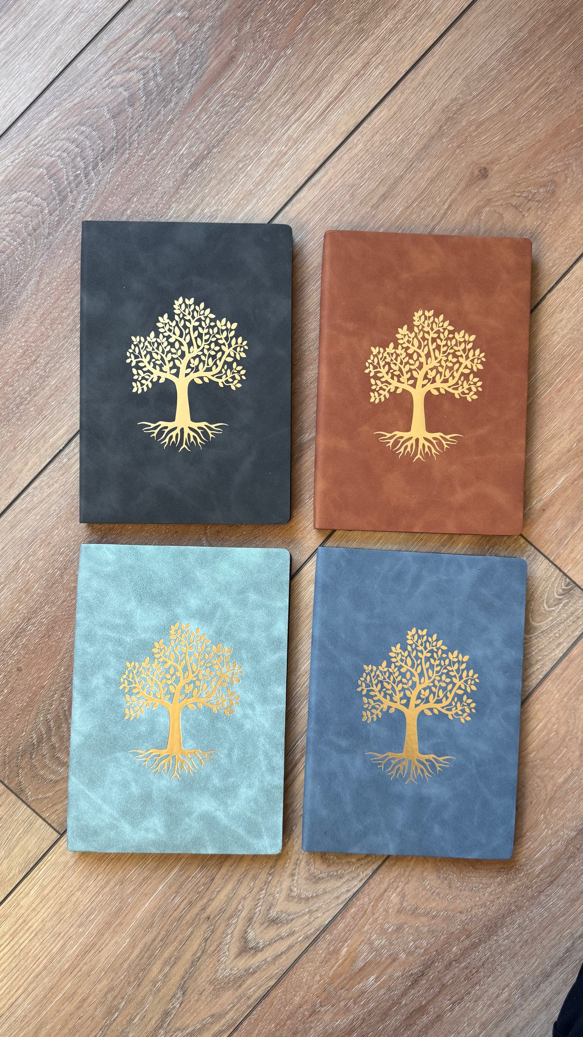 4 different color ways of our Grow Notebook